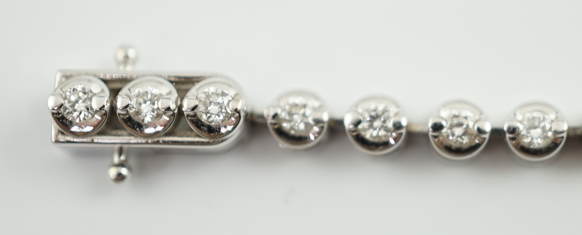 A modern 18ct white gold and diamond set line bracelet